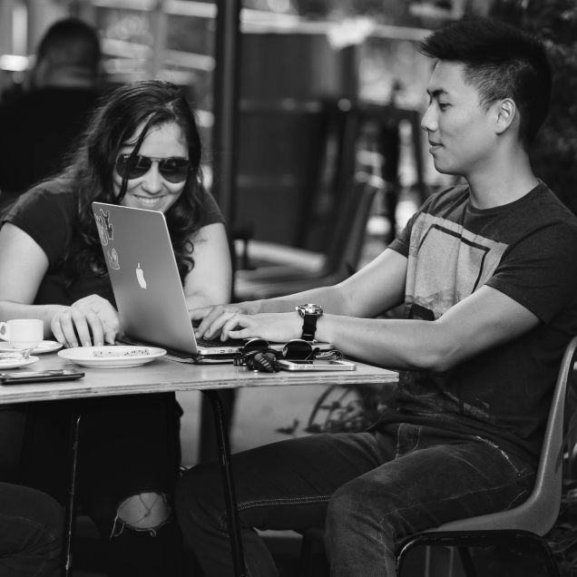 Man and woman infront of computer